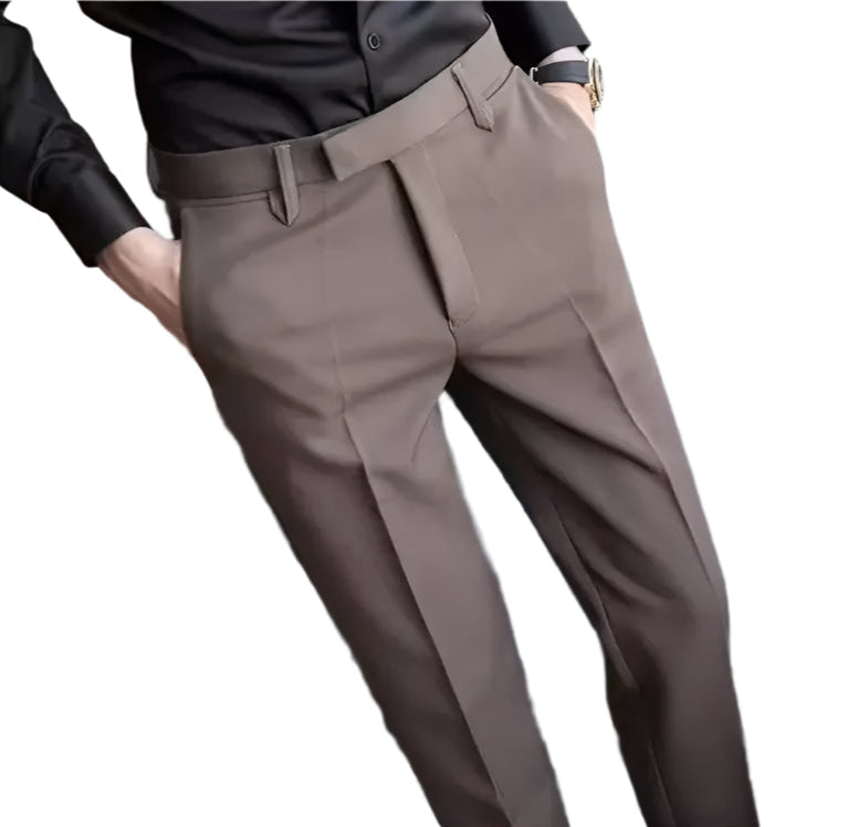 Brown pants worn by a person with a blurred background